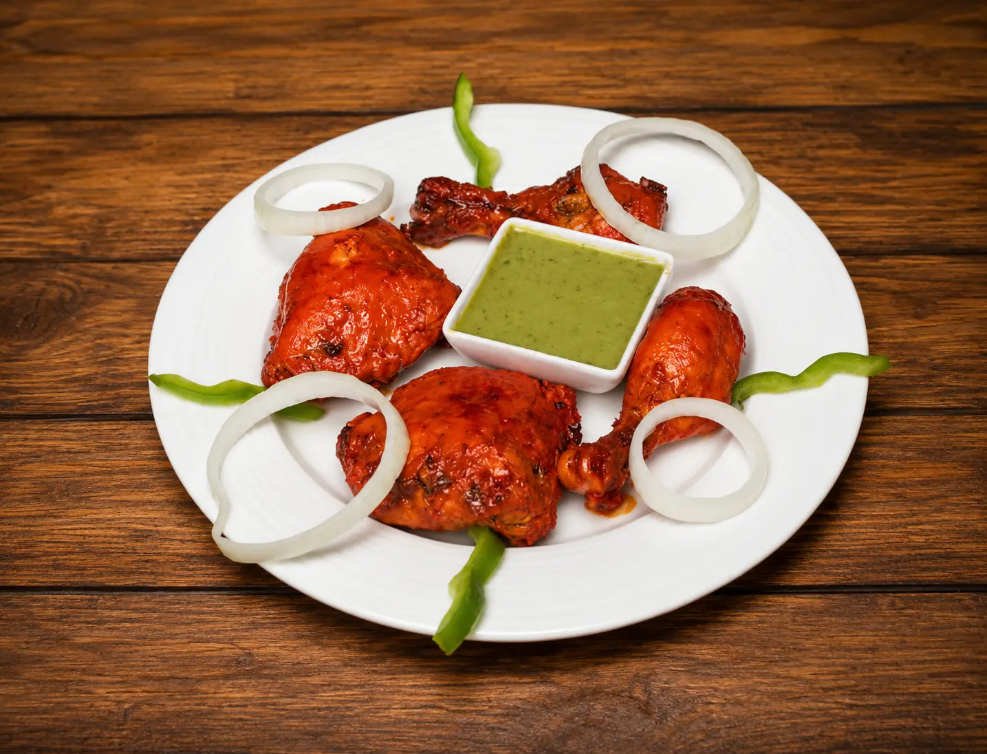 Halal tandoori chicken roasted in a clay oven at Charisma Of India in Winnipeg, MB